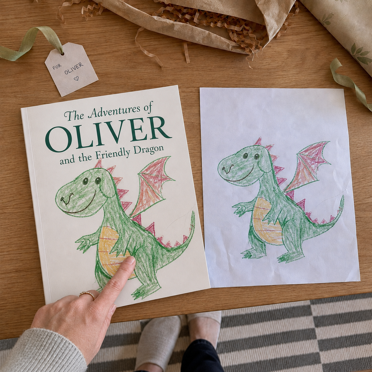 a child's real crayon dragon drawing next to the printed storybook showing that exact drawing on the cover, wrapped as a gift